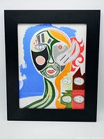 Framed mixed media abstract artwork showing the full portrait and frame.