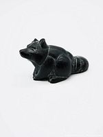Front and side views of the signed black raccoon sculpture showing details of carving and texture.