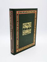 Book in green decorative slipcase with gold and red embossing standing upright.