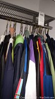 Rack of hanging jerseys and sweatshirt