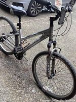 Side view of grey Gary Fisher Napa mountain bike showing frame, seat, pedals and tires.