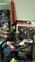 Overall view of lot with bobbleheads, figures, photos and toys