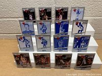 Full display of fifteen Chicago Bulls 25th Anniversary basketball cards on a tiered white stand