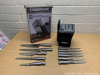 New Farberware 13 piece self-sharpening cutlery set with knives, kitchen shears, and storage block displayed with box.