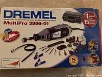 Front of the Dremel MultiPro 3956-01 box showing the rotary tool and 75 accessories included. High-speed rotary tool up to 35,000 RPM.