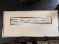 Full view of the framed artwork showing the landscape and frame.