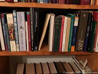 All books on Irish topics arranged on wooden shelves showing titles and spines.