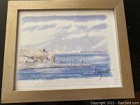 Full view of the framed watercolour painting showing the coastal scene and industrial chimneys.