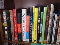 First part of the shelf showing a variety of non-fiction titles including art and bird guides.