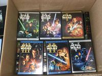 Photo showing six Star Wars DVDs: Episodes I-VI with original cover artworks.