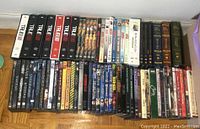 Photo showing the full lot with TV show DVD box sets including True Blood, The Forsyte Saga, Dexter, My So-Called Life, plus movie DVDs including Matrix, X-Men, Spider-man, Dracula, and others.