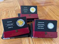 Three RCM presentation cases with coins visible