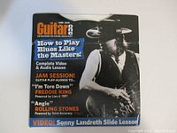 Front cover of the Guitar One June 2005 instructional DVD featuring 'How to Play Blues Like the Masters' with a musician holding a guitar.