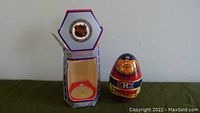 Wooden wobble doll of Montreal Canadiens NHL player next to its original box.