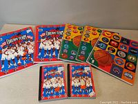 View of all 8 notebooks and journals laid out showing Dream Team player covers and basketball logo designs