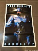 Front side of Robocop 2 Spanish movie poster with prominent image of Robocop and text Proximamente Robocop 2 in large letters.