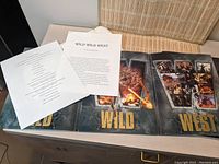 Wild Wild West folder open with summary and production info sheets.