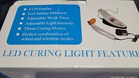 Photo showing the product box details highlighting LCD display, low battery detection, adjustable work time and light intensity, and three curing modes.