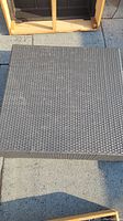 Top view of the square patio table showing woven synthetic wicker surface