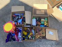 Overview of 5 boxes containing assorted children's toys including farm set, toy vehicles, a drum, and other items