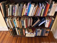 Shelf containing a dense collection of vintage German history and culture books in varying sizes and conditions.