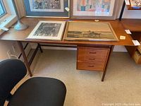 Full frontal view of desk with items on top