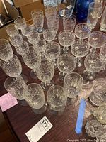 Various sizes of 1930s Libbey Rock Sharpe crystal glasses showing geometric etched patterns.