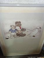 Framed print showing two teddy bears walking a duck and small dog toy on leashes.