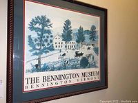 Frontal view of framed Grandma Moses poster showing the full artwork and frame