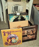 Photo of vinyl records in box including Bob Dylan, Jimi Hendrix, Blood Sweat & Tears, and Neil Young albums.