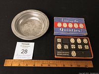 Photo of metal bowl and domino game from overhead