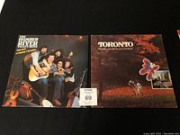 Two vinyl record albums side by side: The Humber River Valley Boys and Toronto various artist album.