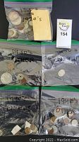 Top-down view of four zip-lock bags labeled by decade containing mixed coins