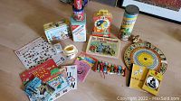 Overview of assorted vintage books, toys, containers, and board games.