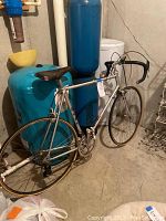 Three-quarter view of entire bicycle against concrete wall