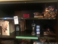 Photo showing Butterick 1970s vintage sewing pattern and boxes of thread on a shelf.