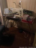 Full view of Bernina Record 830 sewing machine on convertible table with accessories and sewing box visible.