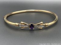 Front view of hinged bangle showing amethyst and diamond accents