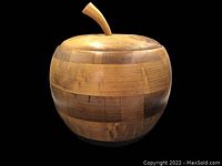 Full view of wooden ice bucket shaped like an apple with segmented wood construction and stem lid