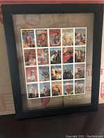 Framed and matted uncut sheet with 20 Roy Rogers cards visible behind glass, showing the card designs and frame.