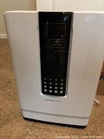 Front view of Hathaspace HEPA air filter showing black digital control panel on white housing.