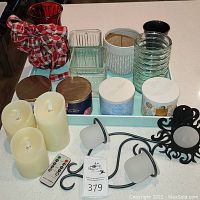 Overview of all items including serving tray with candles, candle holders, and decorative vases arranged on countertop