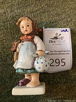 Front angled view of Hummel Weary Wanderer figurine on carpet showing full figure and details