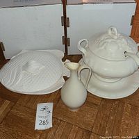 Photo of 13-inch white ceramic fish-shaped platter with scales and matching cover, alongside white tureen and Lenox pitcher