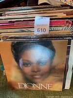 Photo showing front cover of Dionne Warwick LP record among other LPs in collection.