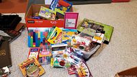 Lot of children’s art and learning materials including crayons, colored pencils, paints, rubber stampers, flashcards, card games, and other craft supplies.