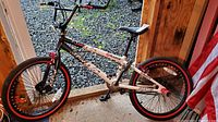 Full side view of the boys Razor Nebula FS20 bike showing frame, wheels, pedals, and seat.