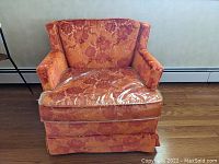 Front view showing overall shape and floral flocked velvet pattern with vinyl slipcover