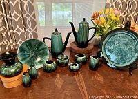 Full set of eleven Blue Mountain Pottery pieces with green glaze including coffee pots, creamers, sweeteners, salt and pepper shakers, tray, pedestal bowl, and vase.