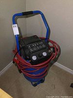 Front-view showing entire compressor with frame and coiled hose